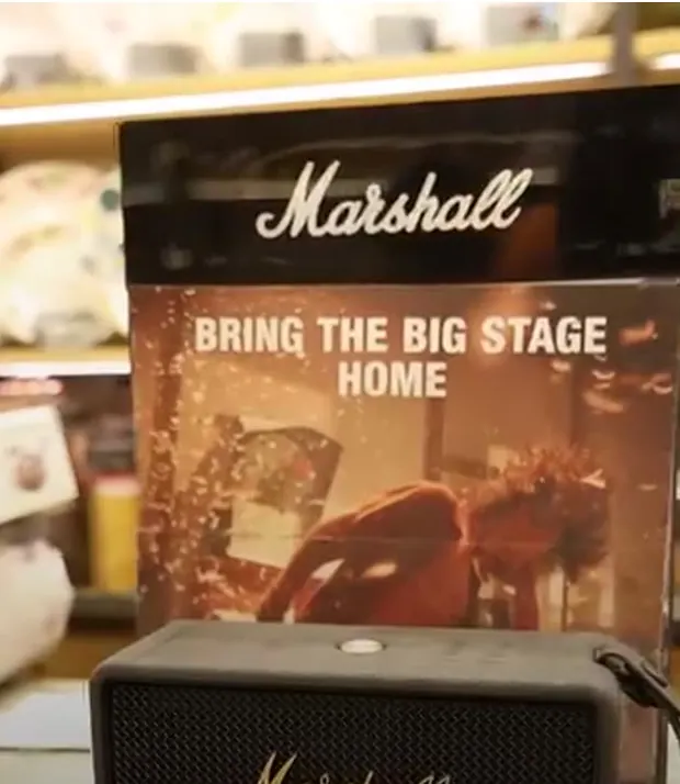 A Marshall portable speaker on the counter in the shop